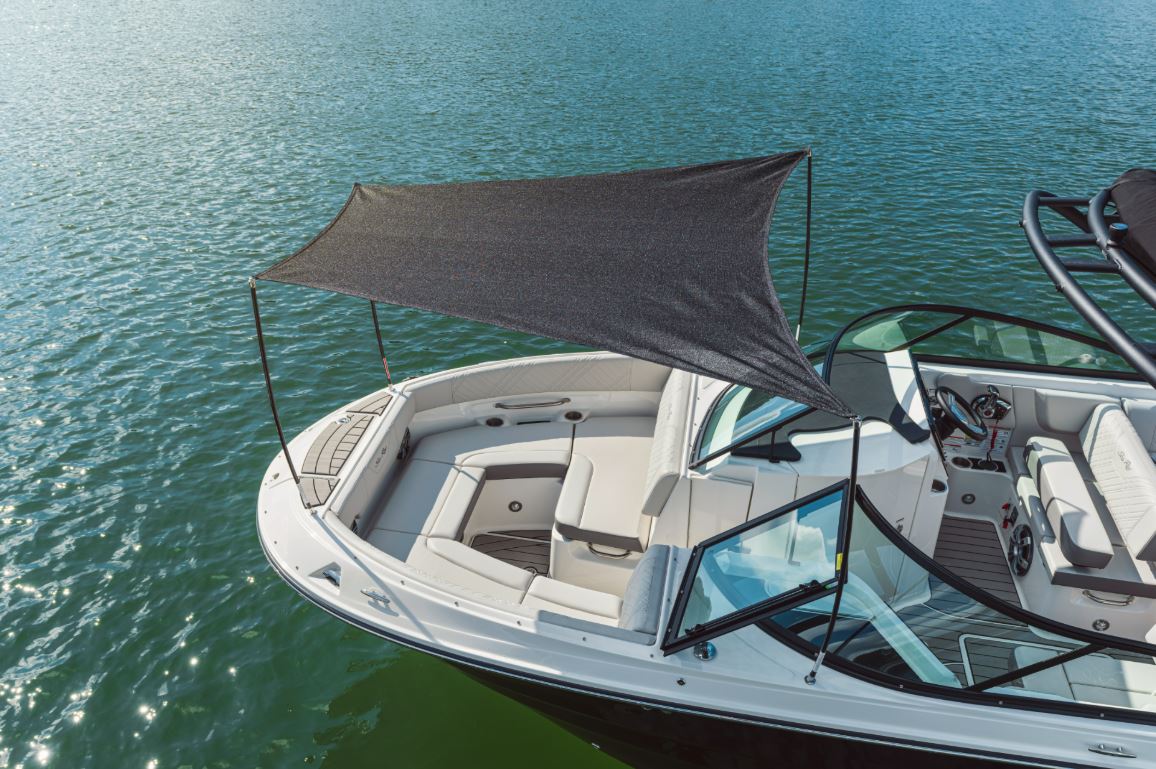 Bowrider Boat Amazing Photo by www.BOWRIDER-BOATS.com — Elevated view of a Sea Ray SDX 250 style bow lounge with removable black sun shade, wraparound seating and open water. Images Created by www.Bowrider-Boats.com