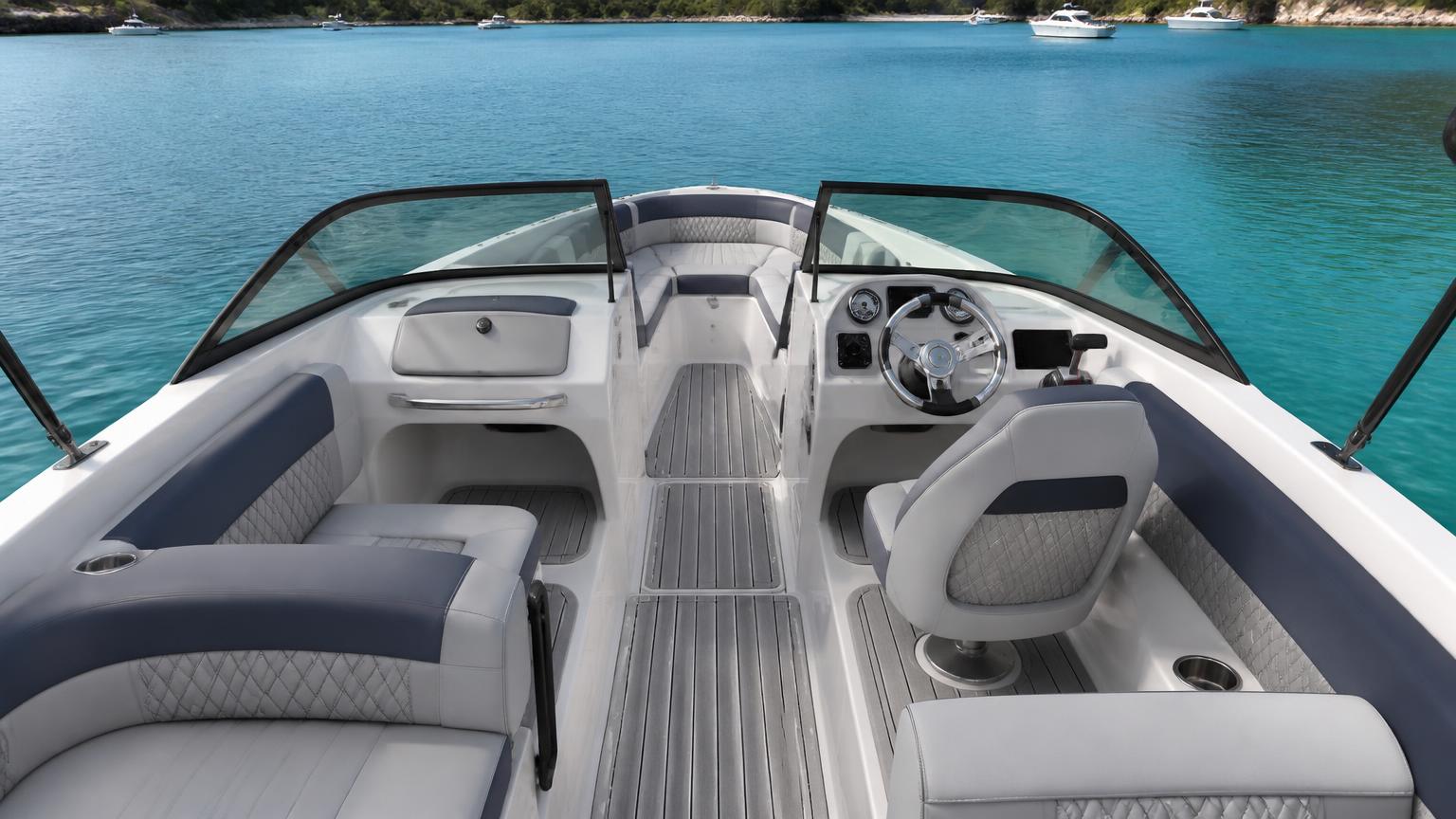 Cockpit interior seating of a 20-foot Bowrider Amazing Photo by www.BOWRIDER-BOATS.com — Cockpit interior seating of a 20-foot bowrider looking forward over dove-grey and navy seating to the walk-through windshield and bow lounge. Images Created by www.Bowrider-Boats.com