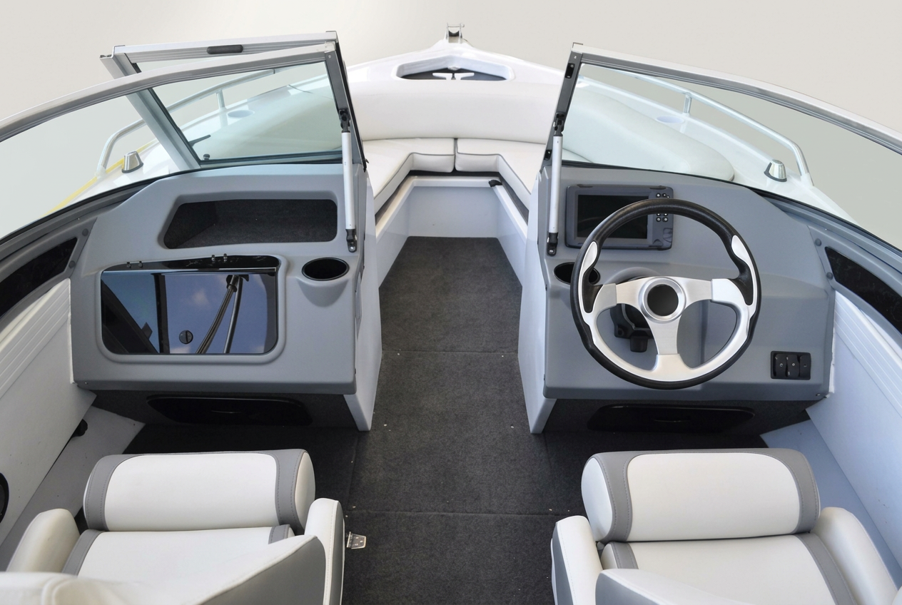 Aluminium Bowrider Amazing Photo by www.BOWRIDER-BOATS.com — Aluminium Bowrider helm dash and driver's console Console Interior Amazing Photo by www.BOWRIDER-BOATS.com — helm dash and driver's console view of a modern aluminium bowrider with grey dash console, steering wheel, multifunction display and twin upholstered bucket seats. Images Created by www.Bowrider-Boats.com. Images Created by www.Bowrider-Boats.com